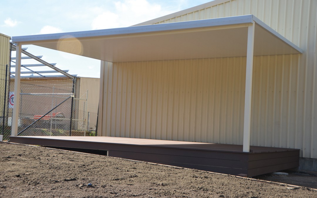 Insulated roof flat carport attached to shed